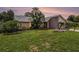 Home exterior showcasing a manicured lawn and attractive landscaping at 3335 Foxridge Cir, Tampa, FL 33618