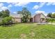 Charming home featuring lush landscaping and a well-maintained lawn at 3335 Foxridge Cir, Tampa, FL 33618