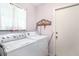 Functional laundry room features a washer and dryer, storage and access to the exterior at 3335 Foxridge Cir, Tampa, FL 33618