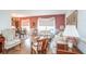 Inviting living room with dining area, chandelier, and natural light at 3335 Foxridge Cir, Tampa, FL 33618