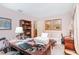 Spacious home office with a large desk, bookshelf and comfortable seating area at 3335 Foxridge Cir, Tampa, FL 33618