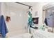 The bathroom features white subway tile and a decorative shower curtain at 3426 Coldwell Dr, Holiday, FL 34691