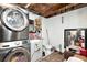 Laundry room with stacked washer/dryer and a utility sink at 3426 Coldwell Dr, Holiday, FL 34691