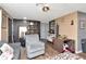 Comfortable living room featuring wood floors, an accent wall, and modern ceiling fan at 3426 Coldwell Dr, Holiday, FL 34691