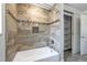 Updated bath with large shower, stylish tile, and built-in shelving at 3437 Aspen Trl, Clearwater, FL 33761
