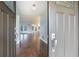 Inviting home entrance with hardwood flooring, open floor plan, and modern lighting at 3437 Aspen Trl, Clearwater, FL 33761