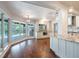 Open-concept kitchen featuring granite counters, a breakfast bar, stainless appliances, and plenty of natural light at 3437 Aspen Trl, Clearwater, FL 33761