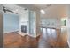 Spacious living room with hardwood floors, fireplace, and access to the pool area at 3437 Aspen Trl, Clearwater, FL 33761