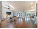 Bright living room with hardwood floors, skylights, and open concept design at 3437 Aspen Trl, Clearwater, FL 33761
