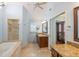 Spacious main bathroom with dual vanities, soaking tub, and walk-in shower at 3437 Aspen Trl, Clearwater, FL 33761