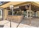 Outdoor kitchen with stainless grill, stone bar and a picturesque view of the backyard oasis at 3437 Aspen Trl, Clearwater, FL 33761