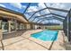 Beautiful screened-in pool with large patio and ample seating area perfect for entertaining friends and Gathering outdoors at 3437 Aspen Trl, Clearwater, FL 33761