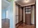 Walk-in closet with custom shelving and storage at 3437 Aspen Trl, Clearwater, FL 33761