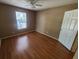 Bedroom featuring wood floors and a window providing natural light at 36137 Lake Chase Blvd # 102, Zephyrhills, FL 33541