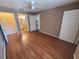 Bedroom with wood laminate flooring with bathroom and closet at 36137 Lake Chase Blvd # 102, Zephyrhills, FL 33541