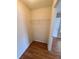 This spacious walk-in closet features built-in shelving and ample storage space for clothes and accessories at 36137 Lake Chase Blvd # 102, Zephyrhills, FL 33541