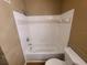 Bathroom with shower and tile surround with handheld shower wand at 36137 Lake Chase Blvd # 102, Zephyrhills, FL 33541