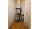 Storage area with a water heater and utility connections on wood-style flooring at 36137 Lake Chase Blvd # 102, Zephyrhills, FL 33541