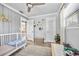 Bedroom with light gray walls, modern lighting, rug, and a cozy crib at 400 53Rd N St, St Petersburg, FL 33710