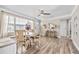 The dining area offers a bright and airy space with natural light streaming through the window and stylish decor at 400 53Rd N St, St Petersburg, FL 33710