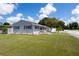Charming single-story home with well-maintained lawn, complemented by lush landscaping and inviting curb appeal at 400 53Rd N St, St Petersburg, FL 33710