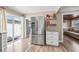Bright kitchen featuring stainless steel refrigerator and adjacent dining and living spaces at 400 53Rd N St, St Petersburg, FL 33710