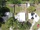 Aerial view of a home showing the structure, yard with fencing, and surrounding neighborhood at 4112 W Lawn Ave, Tampa, FL 33611
