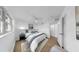 Bright bedroom features hardwood floors, ceiling fan, and ample natural light at 4112 W Lawn Ave, Tampa, FL 33611