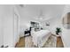 Charming bedroom with a plush bed, modern decor, and a ceiling fan for optimal comfort at 4112 W Lawn Ave, Tampa, FL 33611