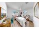 Comfortable bedroom with a Persian rug, ceiling fan and bright, sun-filled windows at 4112 W Lawn Ave, Tampa, FL 33611