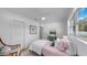 Inviting bedroom with cozy furnishings, wood floors, and a ceiling fan for a relaxed ambiance at 4112 W Lawn Ave, Tampa, FL 33611