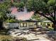 Charming home featuring a well-maintained front yard, fresh exterior paint, and inviting curb appeal at 4112 W Lawn Ave, Tampa, FL 33611