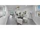 Bright and airy living room featuring stylish furniture, modern lighting, and seamless access to the outdoor patio at 4112 W Lawn Ave, Tampa, FL 33611