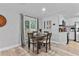 Cozy dining area with wood table and chairs, sliding glass doors to the outside at 4460 67Th N St, St Petersburg, FL 33709