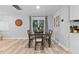 Dining area featuring a wood table, seating for four, and sliding doors with backyard views at 4460 67Th N St, St Petersburg, FL 33709