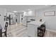 Modern kitchen featuring stainless steel appliances, quartz countertops, and breakfast bar at 4460 67Th N St, St Petersburg, FL 33709