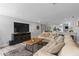 Bright living room featuring an open floor plan, comfortable seating, and a modern entertainment center at 4460 67Th N St, St Petersburg, FL 33709