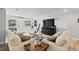 Bright living room with comfortable seating and a modern entertainment center at 4460 67Th N St, St Petersburg, FL 33709