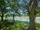 Relax on the swing in the backyard overlooking the lake at 4522 Lisette Cir, Brooksville, FL 34604