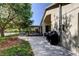 Expansive backyard features a covered patio, dining area and barbecue at 4522 Lisette Cir, Brooksville, FL 34604