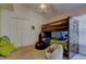 Bedroom with a bunk bed, carpet flooring, and ample space for play at 4522 Lisette Cir, Brooksville, FL 34604