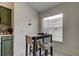 Charming breakfast nook with window and bar stool seating, a cozy spot for morning coffee or a casual meal at 4522 Lisette Cir, Brooksville, FL 34604