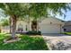 Charming single-story home featuring a well-manicured lawn and a spacious two-car garage at 4522 Lisette Cir, Brooksville, FL 34604