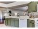 View of kitchen highlighting counterspace and green cabinetry at 4522 Lisette Cir, Brooksville, FL 34604