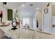 Bright kitchen featuring a marble countertop, modern faucet, and stylish decor at 4522 Lisette Cir, Brooksville, FL 34604