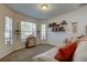 Cozy living room with a comfortable couch, decorative shelves, and lots of natural light at 4522 Lisette Cir, Brooksville, FL 34604