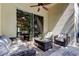 Cozy covered patio features comfortable seating and serene backyard views at 4522 Lisette Cir, Brooksville, FL 34604