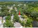 Aerial view of a neighborhood surrounded by lush greenery and a winding river, showcasing the property's location at 4639 Cabbage Palm Dr, Valrico, FL 33596