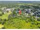 Aerial view showcasing the property's location near a pond and surrounded by verdant landscapes at 4639 Cabbage Palm Dr, Valrico, FL 33596