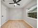 Bright bedroom with a ceiling fan and natural light from a large window at 4639 Cabbage Palm Dr, Valrico, FL 33596